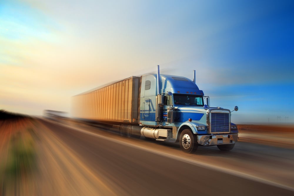 bigstock-American-truck-speeding-on-fre-15795809